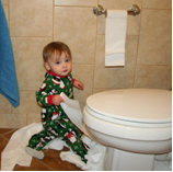 child with toilet paper