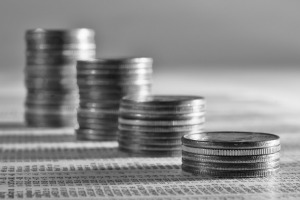 stacks of quarters on table, featured on MarketResearch.com www.blog.marketresearch.com