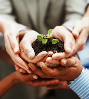 hands_holding_soil_and_plant_growing, featured on www.blog.marketresearch.com