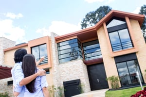 Couple looking at a beautiful house to buy