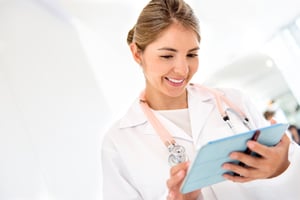 Female doctor using app on a tablet computer