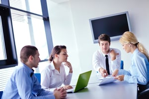Group of happy young  business people in a meeting at office-1