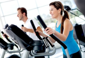 Group of people at the gym exercising on the xtrainer machines