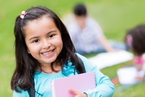 Portrait of a cute girl looking happy at the school
