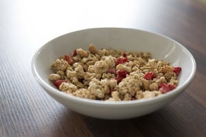 Breakfast cereal in a white bowl on a kitchen table