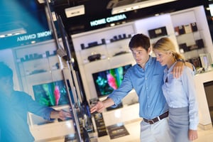 couple browsing consumer electronics store